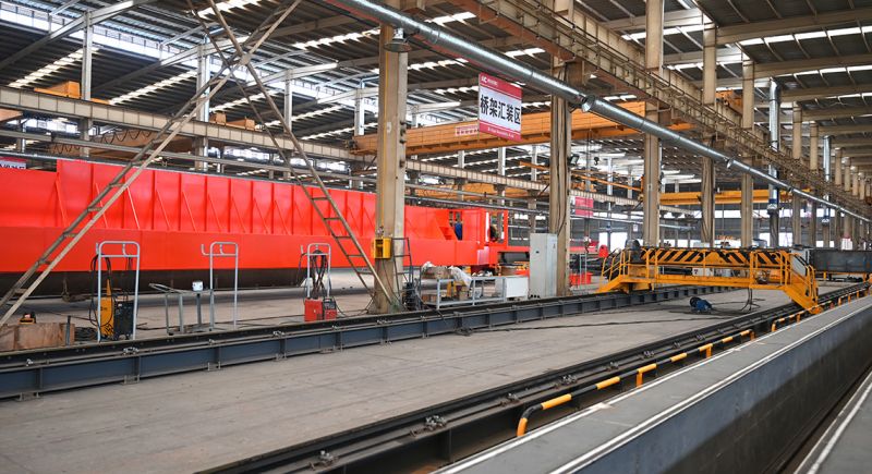 End beam interchangeable bridge assembly platform